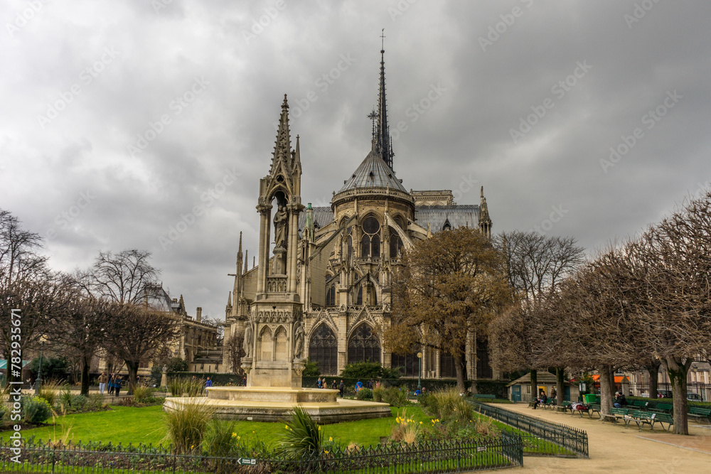 Notre dame in Paris, France against a clouded sky Notre dame in Paris, France against a clouded sky