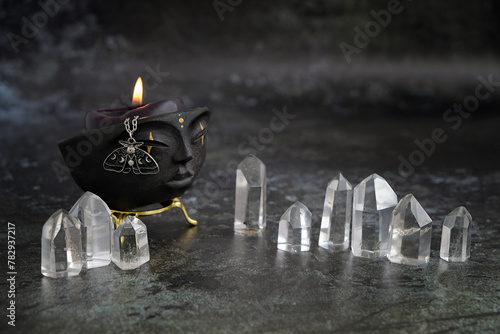 witchcraft bowl with candle and amulet, quartz crystals on dark abstract  background. Magic Crystal Ritual, esoteric spiritual practice. stone therapy for life balance, soul relax, harmony