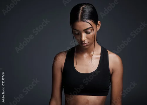 Obraz Indian woman, thinking and exercise workout in studio or thoughts of fitness, training or black background. Female person, mockup space and future goal with healthy weight loss, routine or challenge