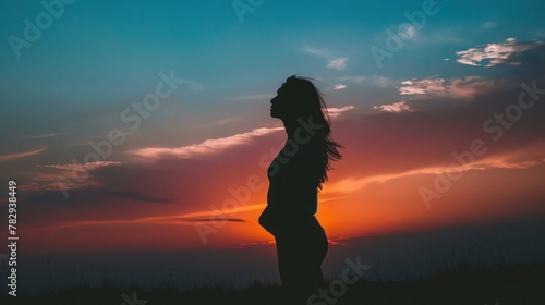 silhouette of woman at sunset , Standing posture