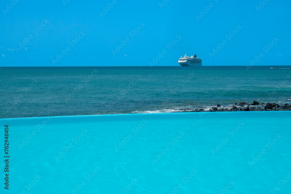 Three gorgeous tones of blue on the shores of São Tomé, São Tomé and Principe (STP), Central Africa. A tendered cruise ship in the background Three gorgeous tones of blue on the shores of São Tomé, São Tomé and Principe (STP), Central Africa. A tendered cruise ship in the background