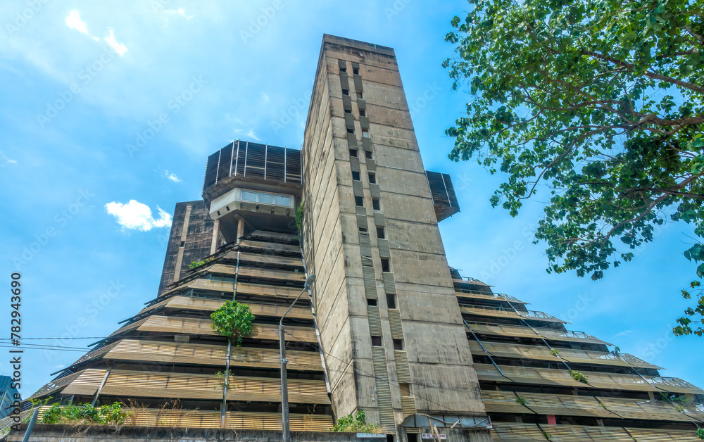 Ruins of the modern concrete pyramid building structure, a 60's architectural masterpiece in Abidjan, a symbol of its past glory, Côte d'Ivoire (Ivory Coast), West Africa - obrazy, fototapety, plakaty 