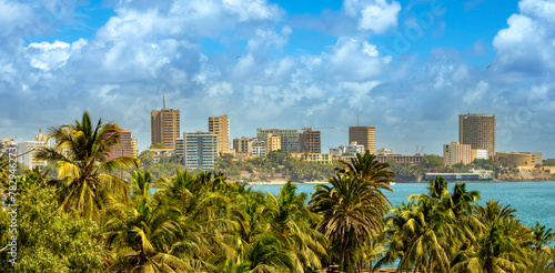 Contrasting tropical palm trees and modern architecture in the city center of Dakar, Senegal, West Africa