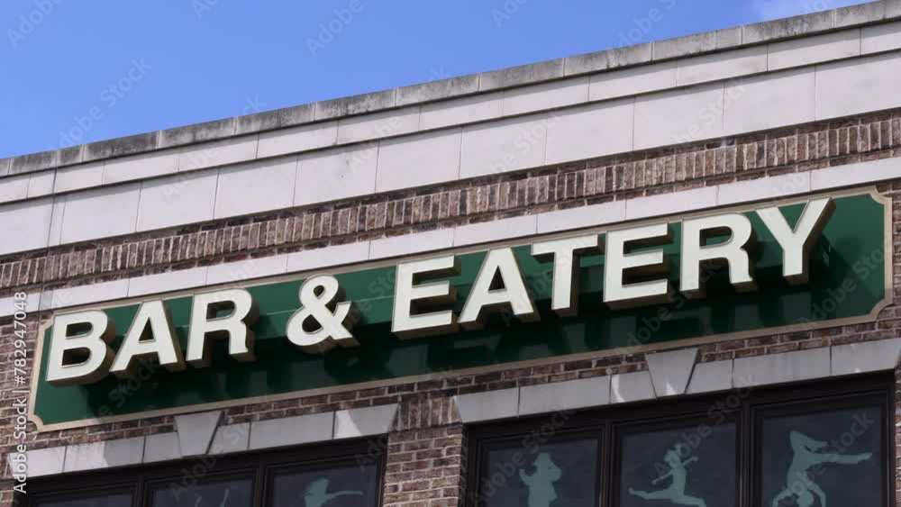 Bar and eatery sign on the building Bar and eatery sign on the building