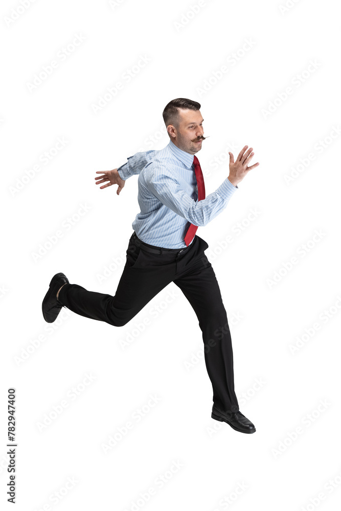 Motivated young man, entrepreneur fast running wearing in smart casual outfit against transparent background. Concept of business, work, human emotions, facial expression, sales, ad. Motivated young man, entrepreneur fast running wearing in smart casual outfit against transparent background. Concept of business, work, human emotions, facial expression, sales, ad.