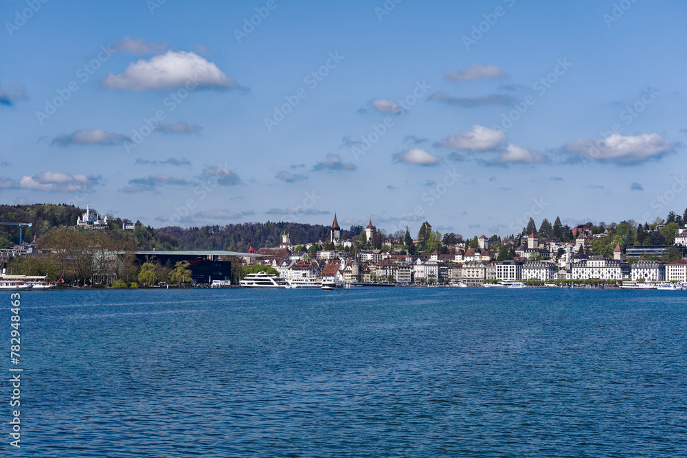 Obraz premium Scenic view of Lake Lucern with the old town of Swiss City of Lucerne in the background on a sunny spring day. Photo taken April 11th, 2024, Lucerne, Switzerland.