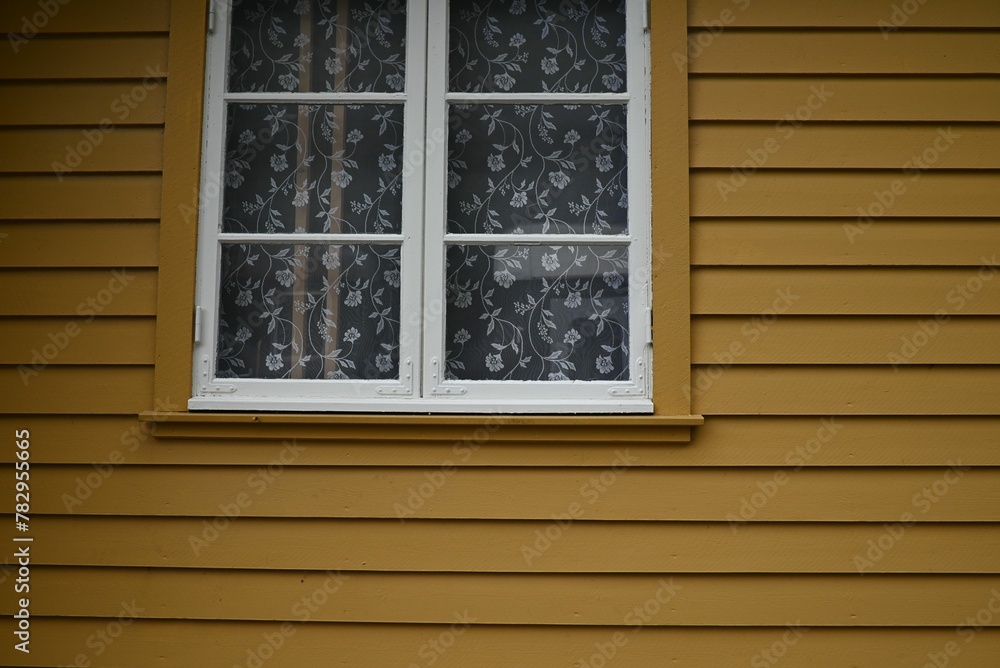 Window of a yellow house in Flam, Norway