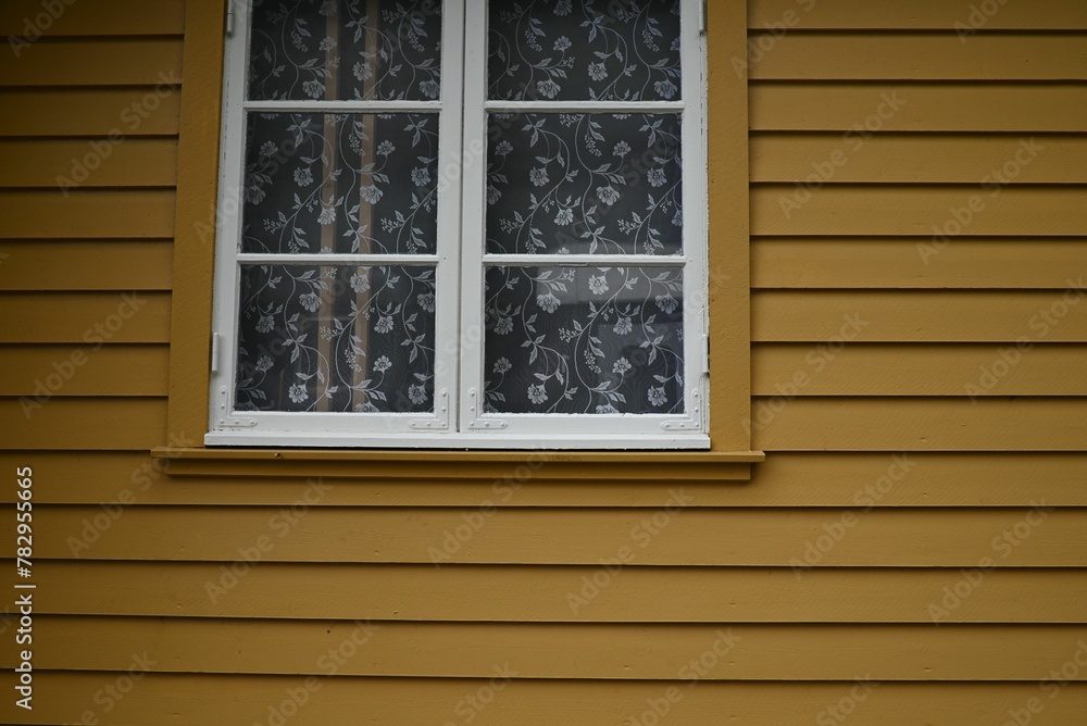 Window of a yellow house in Flam, Norway Window of a yellow house in Flam, Norway
