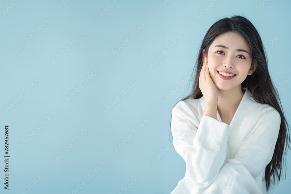 A woman with long hair wearing a white shirt. A woman with long hair wearing a white shirt.