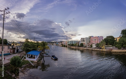 Evening shot of the San Juan river surrounded by buildings in the province of Matanzas photo