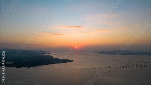 Mesmerizing scene of Sunset at the seaside, perfect for background © Wirestock
