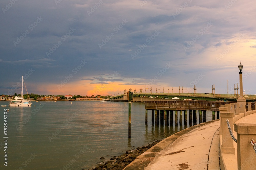 Breathtaking view of sunset clouds over the lakeshore with Bridge of Lions in the background