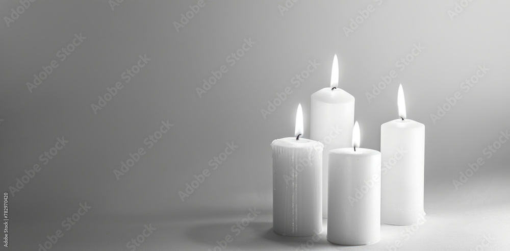 Group of three white candles, perfect for home decor or relaxation ambiance Group of three white candles, perfect for home decor or relaxation ambiance