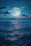 A stunning view of a full moon rising over the ocean at night. Perfect for nature and astronomy concepts