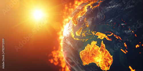 Earth globe under the extreme heat of the sun, Australia and South East Asia burning in fire, conceptual illustration of global warming, temperature increase and climate change disaster photo
