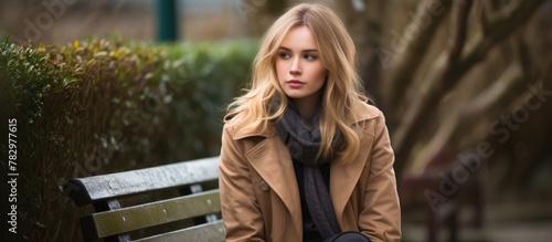 Blonde woman on park bench