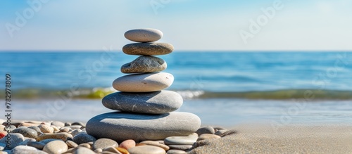 Stack of stones by shore