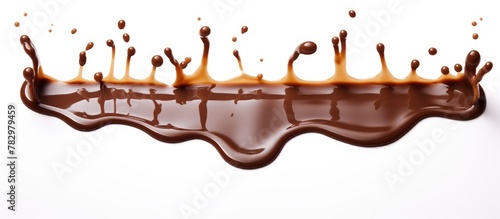 Chocolate syrup flowing on white surface background photo