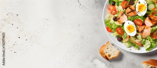 Salmon Caesar salad with vegetables and croutons