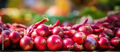 Red onions stacked on a table