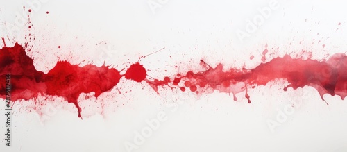 Red paint splatter on white...