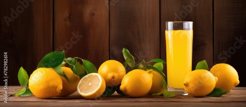 Glass of orange juice and lemons in close-up