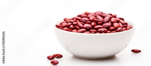 Bowl of red beans on white surface