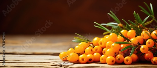Orange berries on wooden su...