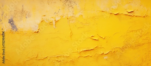 Yellow peeling paint on a wall photo