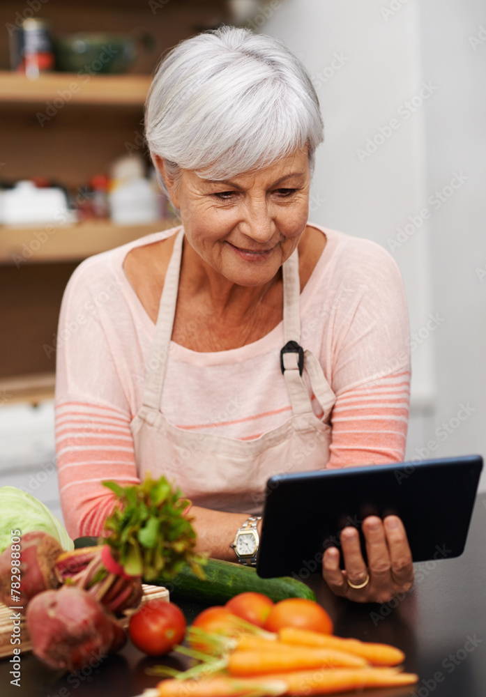 Senior woman, tablet and vegetables for cooking wholesome, healthy and nutritional food at home. Retired lady, ingredients and digital device for researching diet, recipes and delicious vegan meals Senior woman, tablet and vegetables for cooking wholesome, healthy and nutritional food at home. Retired lady, ingredients and digital device for researching diet, recipes and delicious vegan meals