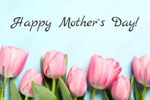 Happy Mother's Day greeting card. Beautiful tulip flowers on light blue background