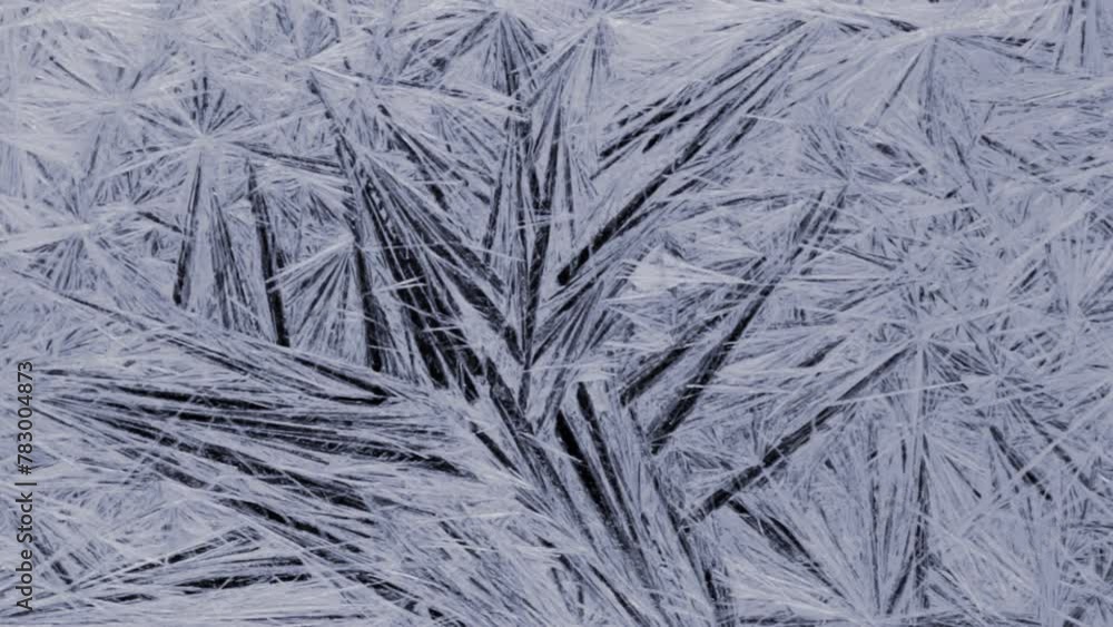 Frosty pattern on a black background in motion Frosty pattern on a black background in motion