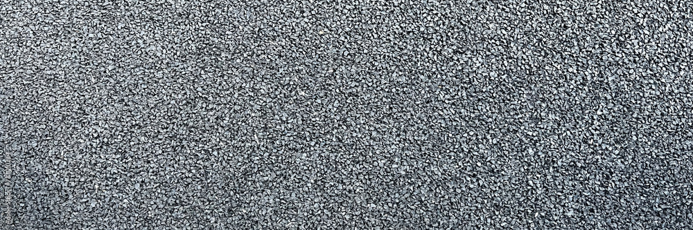 A textured asphalt background in grunge grey with abstract patterns A textured asphalt background in grunge grey with abstract patterns