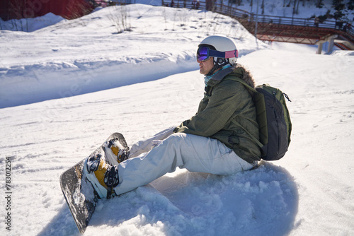 Snowboarder's Rest on the Mountain