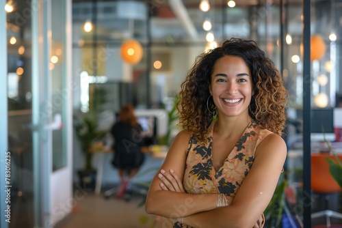 Confident Businesswoman Smiling in a Modern Co-Working Space With Team in Background