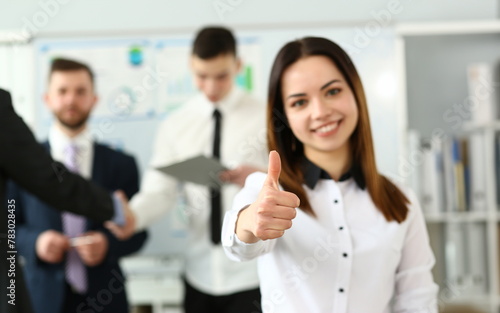 Female arm show OK or approval with thumb up in creative people office portrait. High level quality product serious offer conference mediation solution advisor participation concept