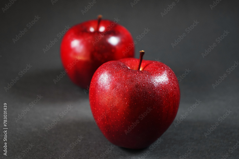 Ripe red apples closeup on a dark background Ripe red apples closeup on a dark background