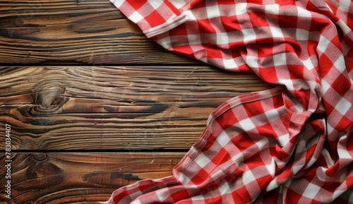 Red and white checkered tablecloth on wooden background with copy space for text or product, layout template. Design layout for menu card, food advertising poster or restaurant interior design