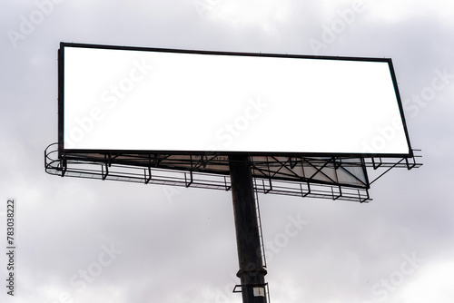 Blank Billboard screen on the street, 2024 mock-up vertical. Outdoor mockup promotion poster - A blank billboard against a blue sky