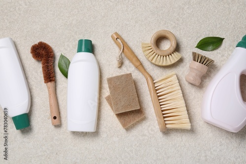 Flat lay composition with different cleaning supplies on beige background
