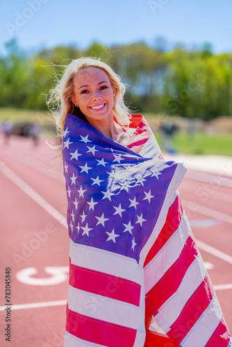 Symbol of Triumph: Proud American Athlete Honors Nation with Flag Display