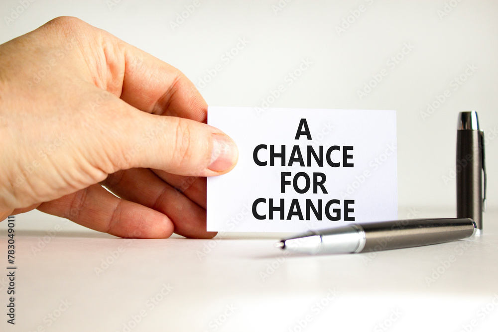 A chance for change symbol. Concept words A chance for change on beautiful white paper. Beautiful white background. Voter hand. Business A chance for change concept. Copy space. A chance for change symbol. Concept words A chance for change on beautiful white paper. Beautiful white background. Voter hand. Business A chance for change concept. Copy space.