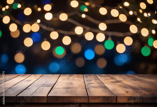 Empty wood table with blurred Christmas lights set behind the table