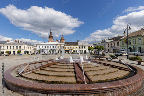View of the Market Square on a sunny day with fountain, Nowy Sacz, Poland