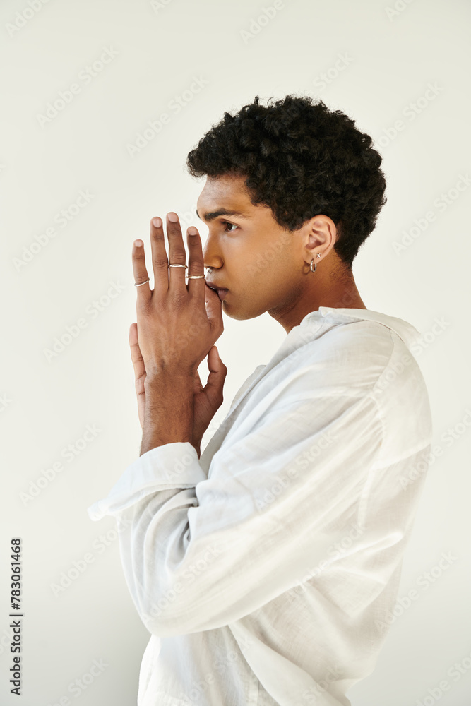 debonair elegant african american man in chic linen clothing looking away on beige backdrop debonair elegant african american man in chic linen clothing looking away on beige backdrop