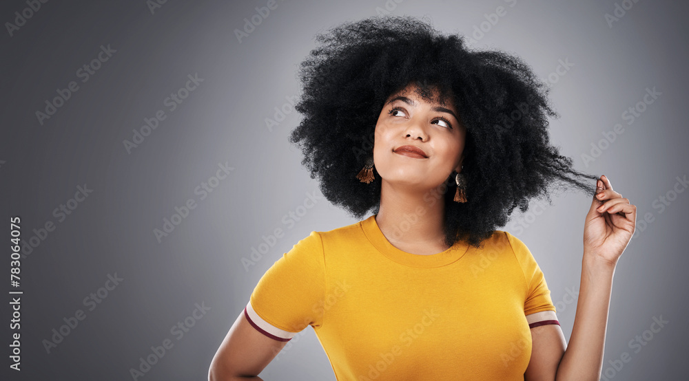 African woman, thinking and hair in studio for with ideas for natural texture, care and growth on gray background. Curly girl, model or person with hairstyle tips, choice and decision on banner space