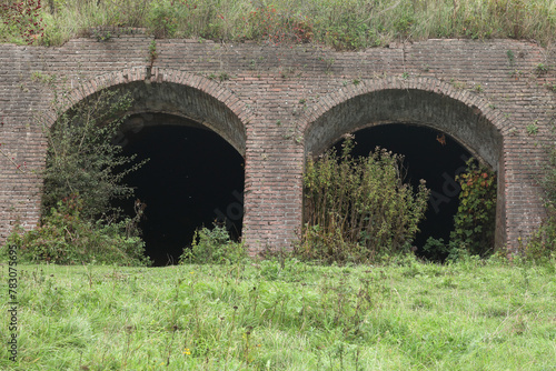An old brick factory in Fortmond, the Netherlands, is slowly overgrown with plants and trees
