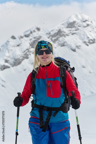 A Female Mountaineer Ascends the Alps with Backcountry Gear