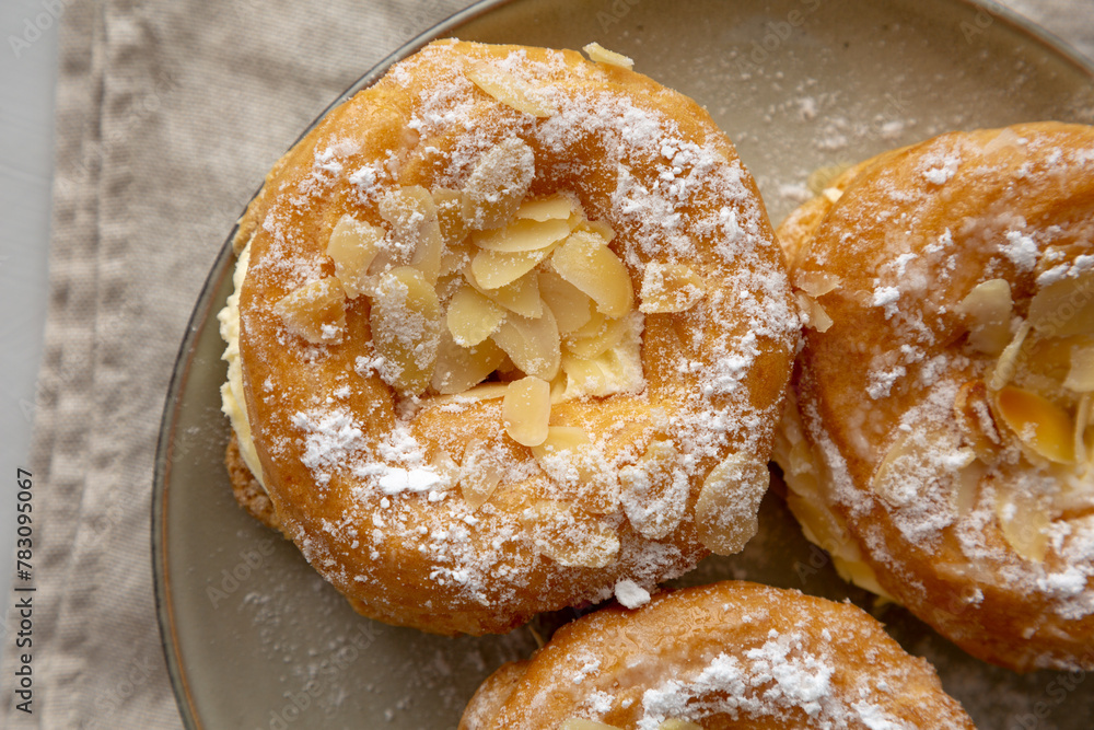 Homemade Paris Brest on a Plate, top view. Flat lay, overhead, from above.