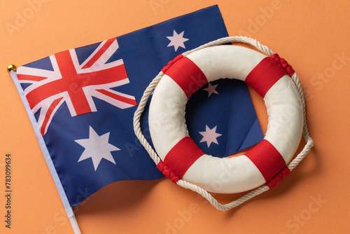 Australia flag and lifebuoy on a colored background, concept on the theme of help